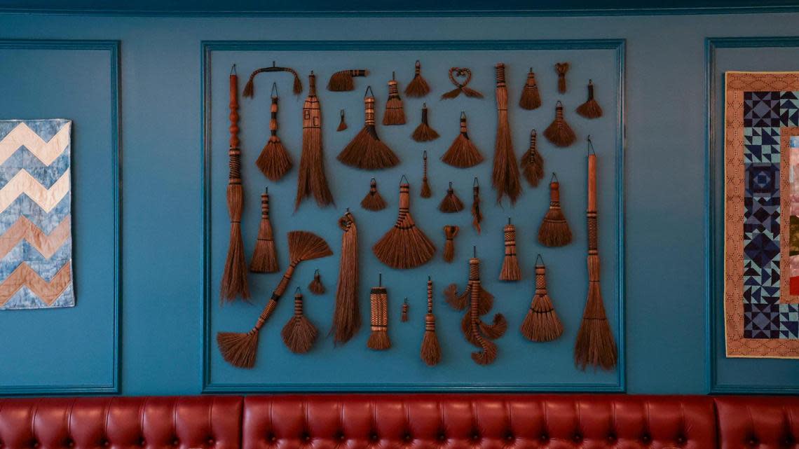 A collection of broom craft hang on the wall of Crafted at Boone Tavern July 14, 2025 at Crafted at Boone Tavern, the restaurant at the Historic Boone Tavern Hotel in Berea.