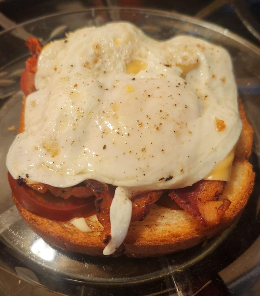 Bacon, egg, cheese, Kumato brown tomatoes.