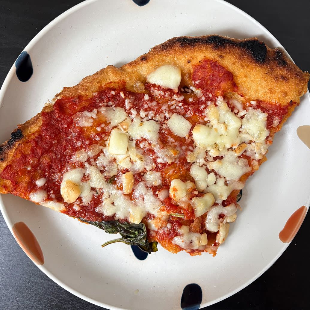 slice of fried montanara pizza on a decorative plate