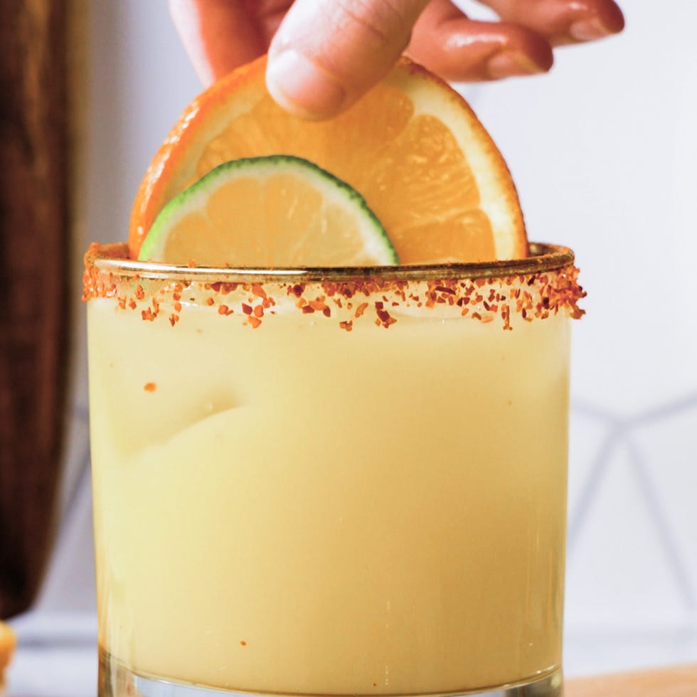 a mezcalita garnished with citrus slices.