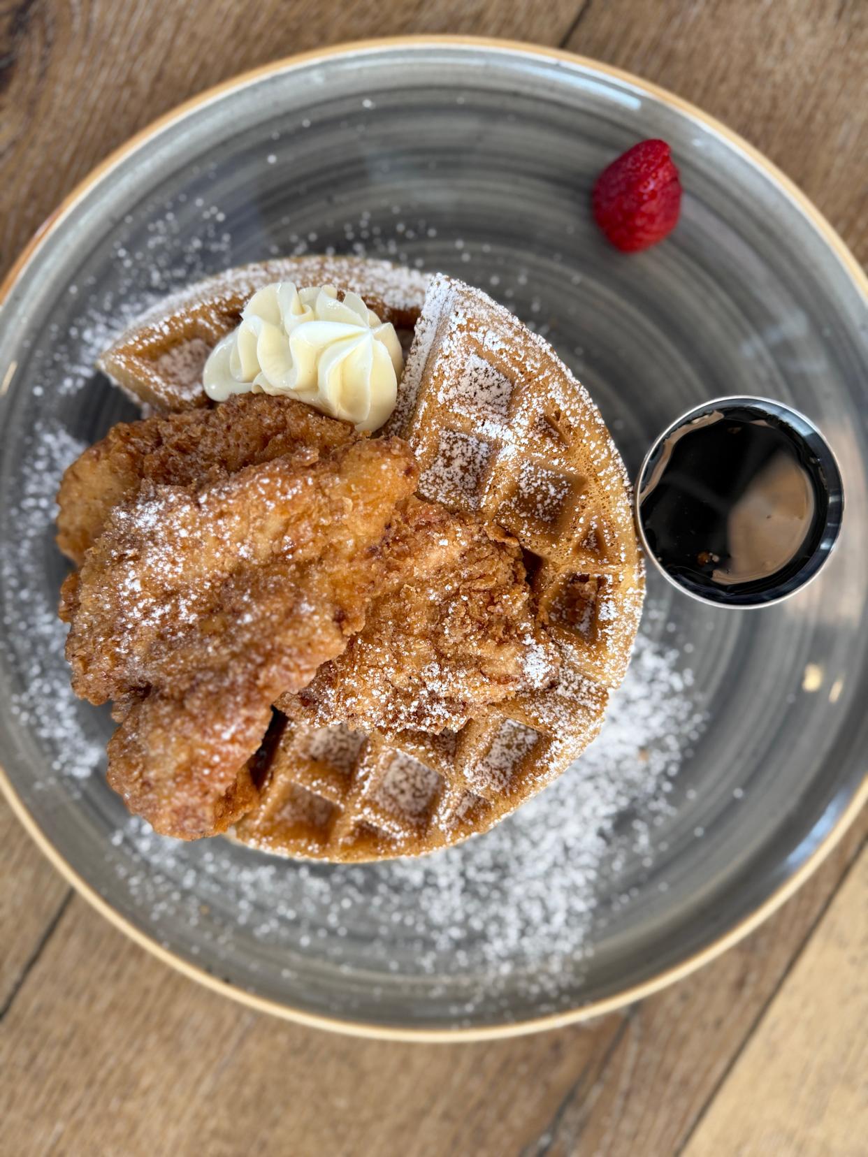 The Cage, in Warrington, brunch menu features sweet and savory dishes, like the Fried Chicken on a Jalapeño Cheddar Waffle served with chipotle maple syrup.