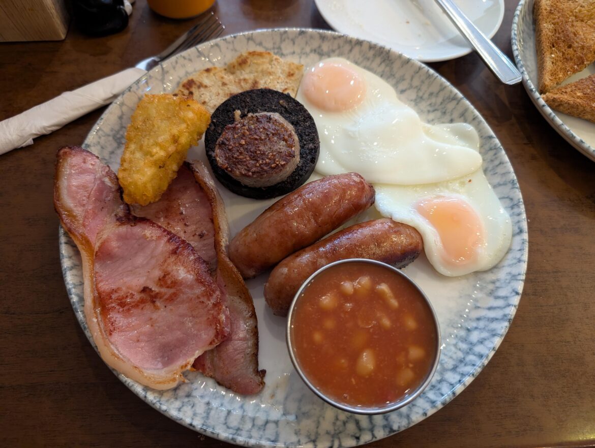 "The Big and Tasty", O'Toole's Irish Cafe, Coventry, £10.85, toast off to the side. Toms replaced with a hash brown. Bigger option with extra sausage, mushrooms, and pudding was £14.