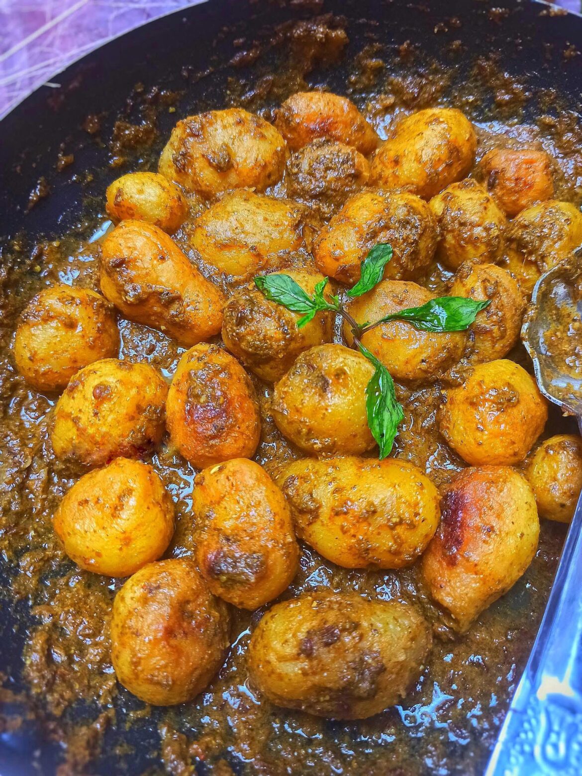 Potatoes tossed in a spicy herb sauce