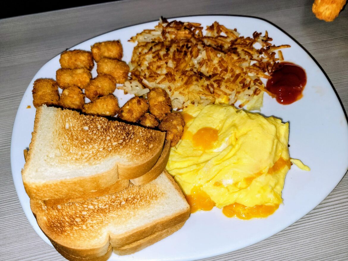 Hash browns, tater tots, eggs and cheese, and white toast.