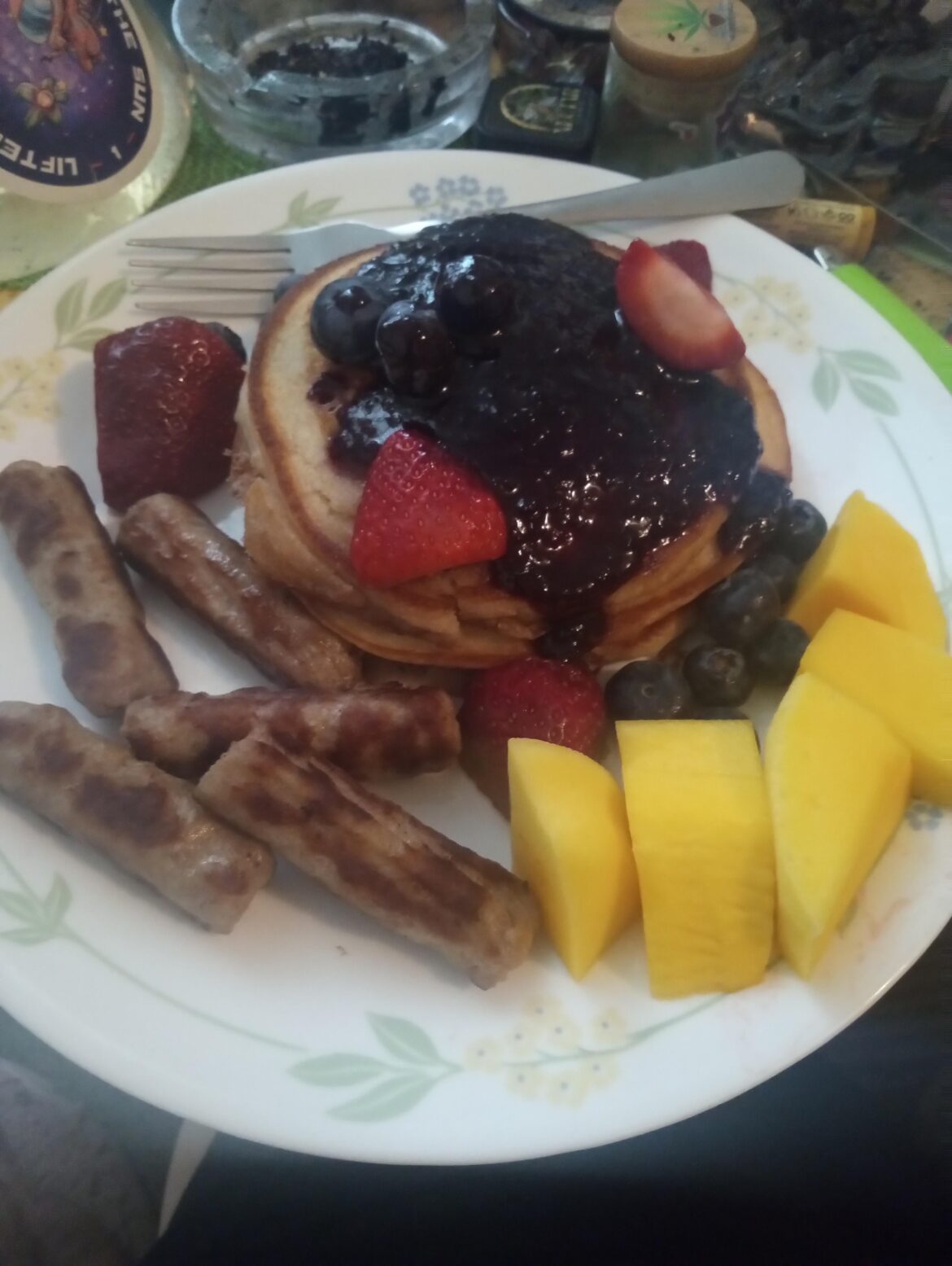Pancakes with Blueberries and Strawberries. Mango and Sausages.
