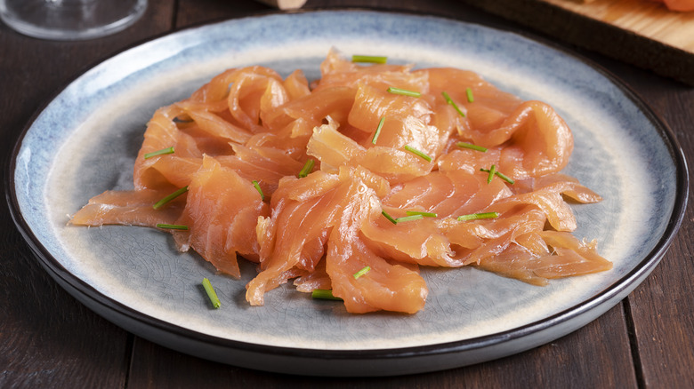 Smoked salmon on a blue plate
