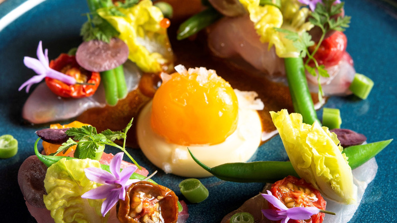 Dish with confit egg yolk