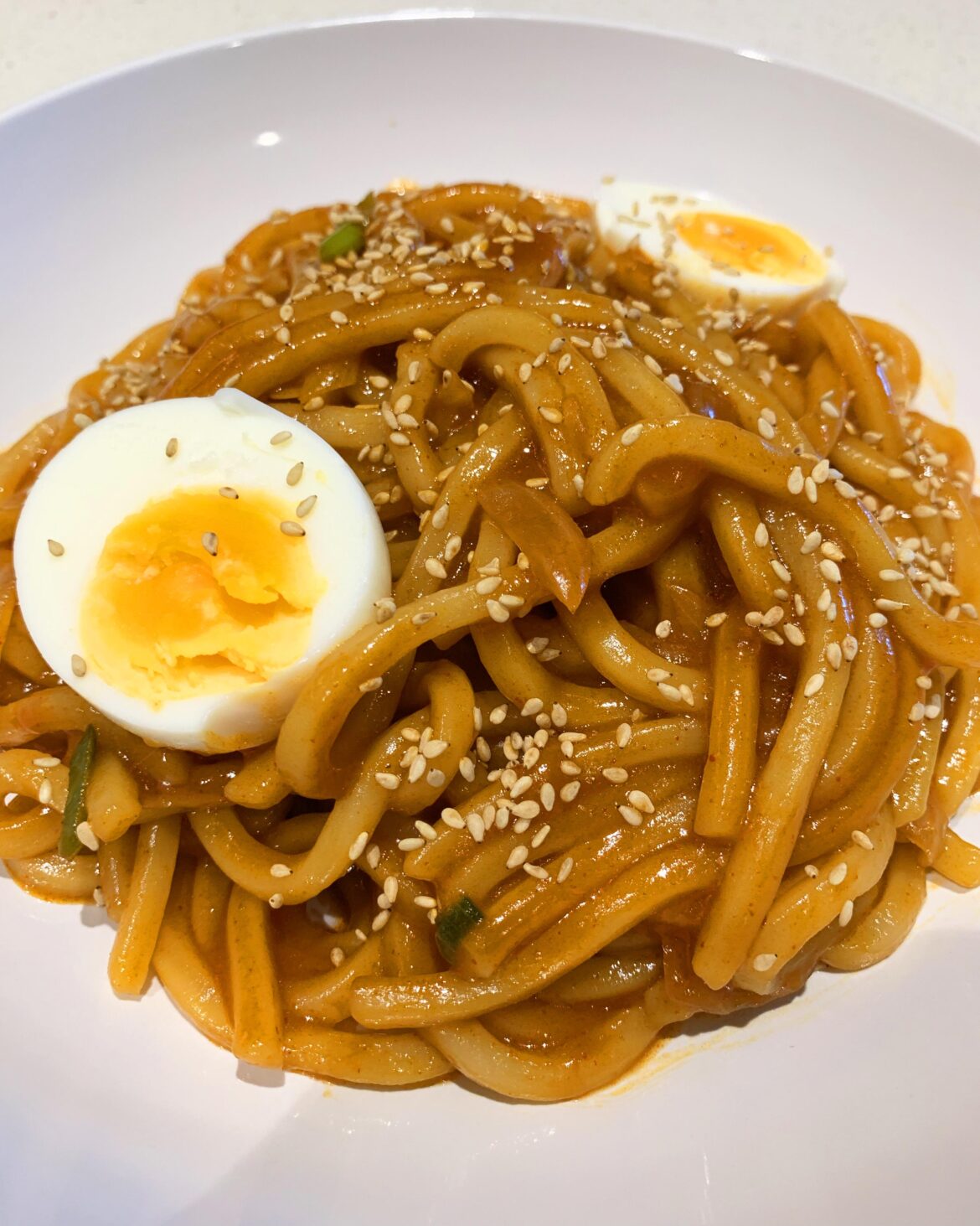 Korean Style Spicy and Sweet Udon Stir Fry with Boiled Egg on Top Korean Style Spicy and Sweet Udon Stir Fry with Boiled Egg on Top