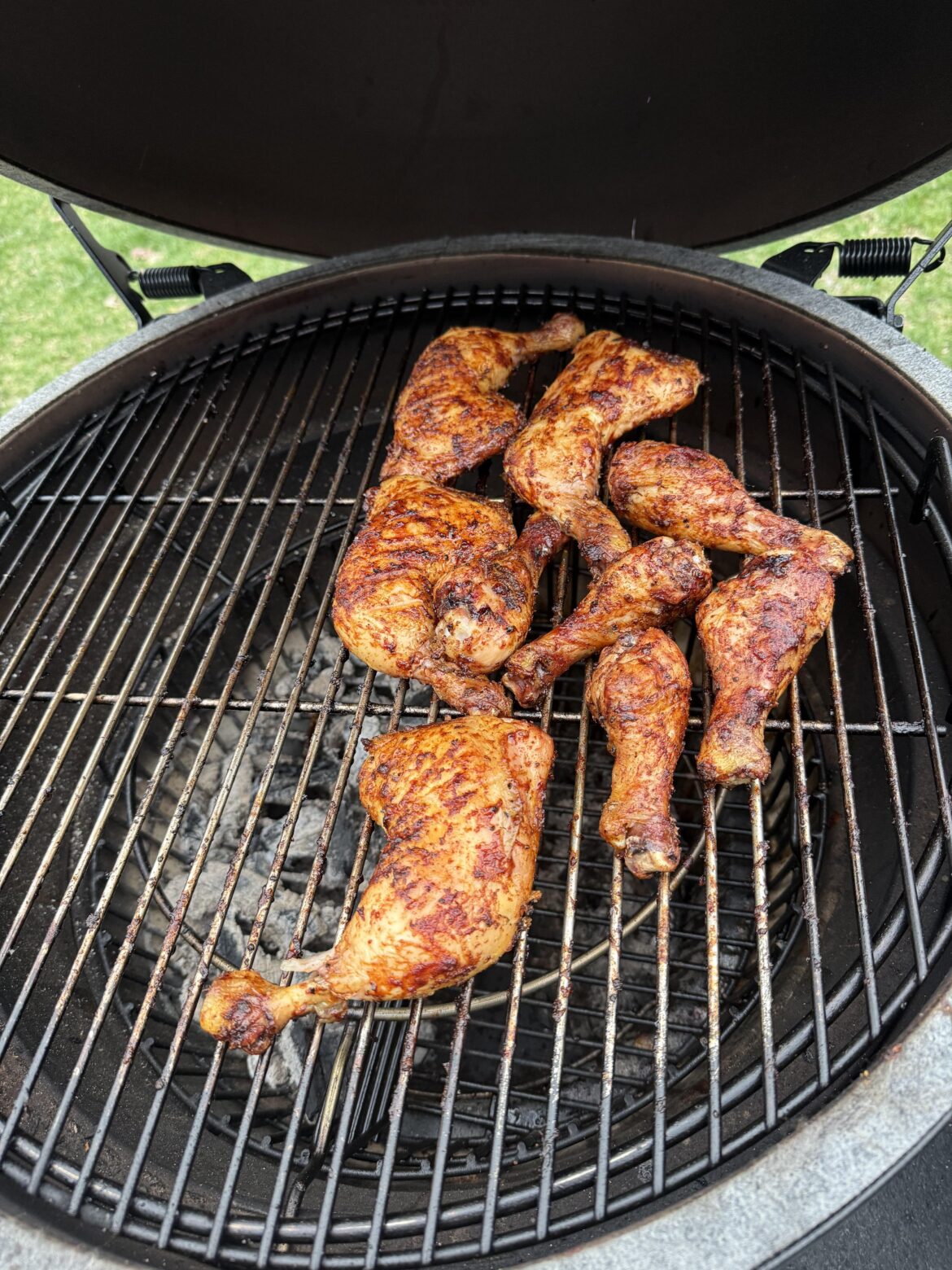 Some chicken quarters, over the coals