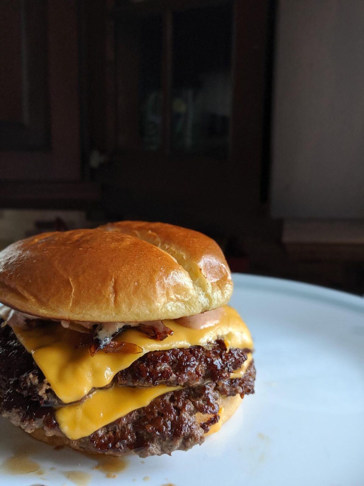 Homemade double smash burger with caramelized onions and special sauce
