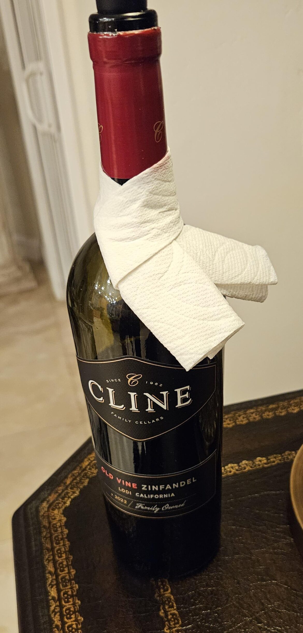 I make these little wine bottle cravats out of half a paper towel to prevent dripping.