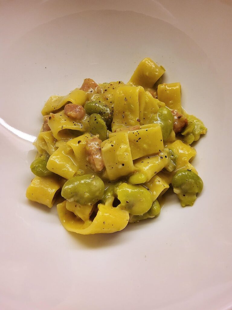Calamarata with fava beans, salsiccia, onion, garlic, butter, salted anchovies*, grana padano and a drizzle of lemon juice