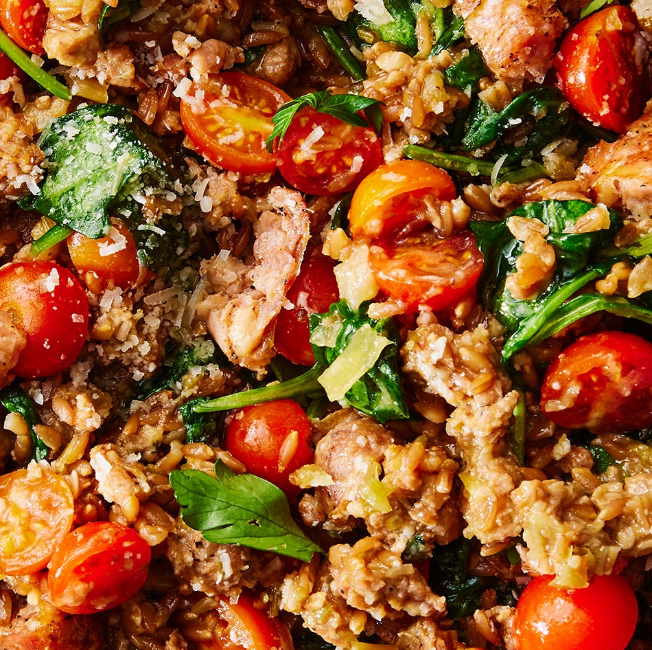 one pot farro with chicken sausage and tomatoes topped with fresh herbs