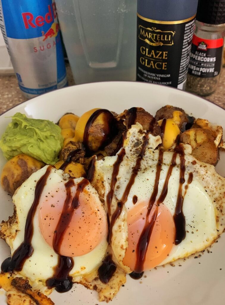 Spicy potatoes with fried eggs and some melty cheese n guac thrown on top
