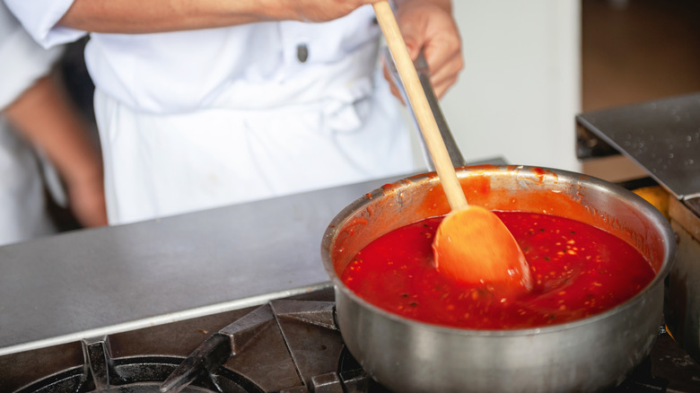 Chef cooking marinara sauce