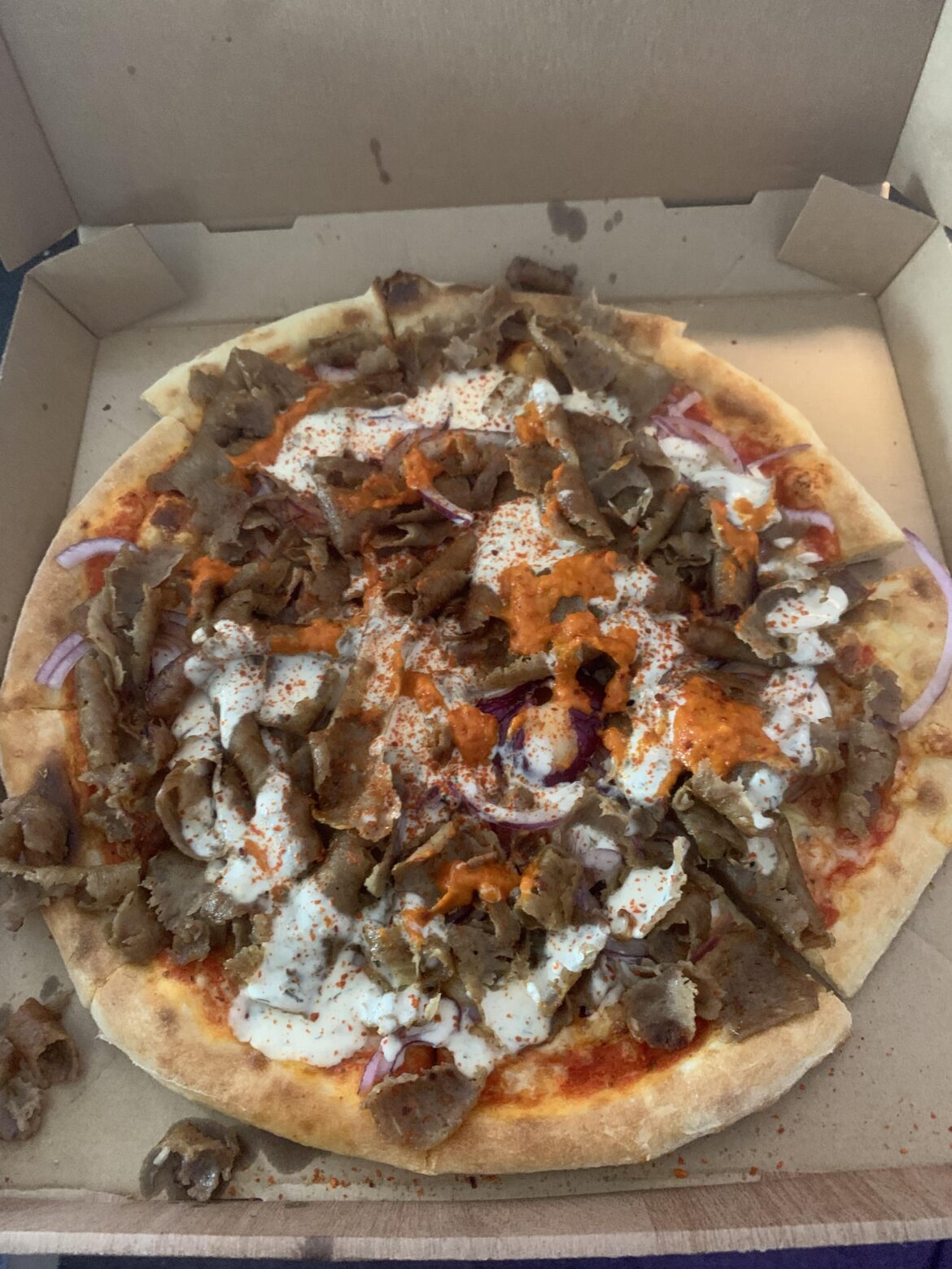 [I ate] Döner Pizza with extra onions, both sauces and a little spicy