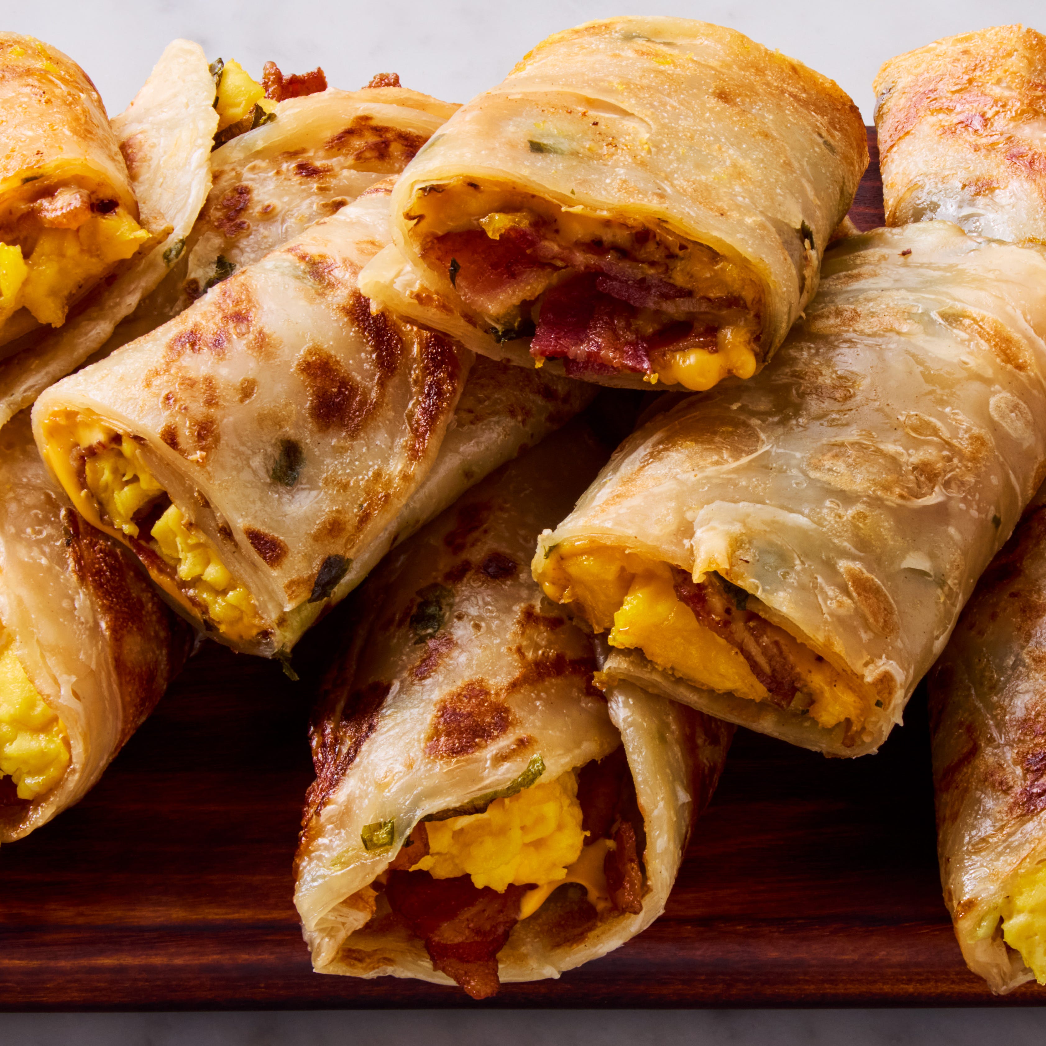 scallion pancake wraps with bacon, egg, and cheese