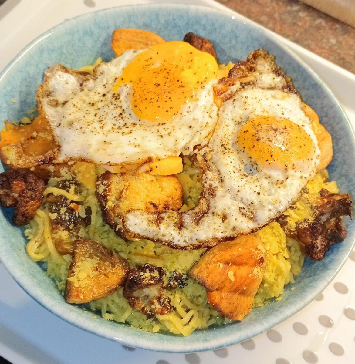 Noodles, roast sweet pot and cauliflower and a couple of my hens eggs.