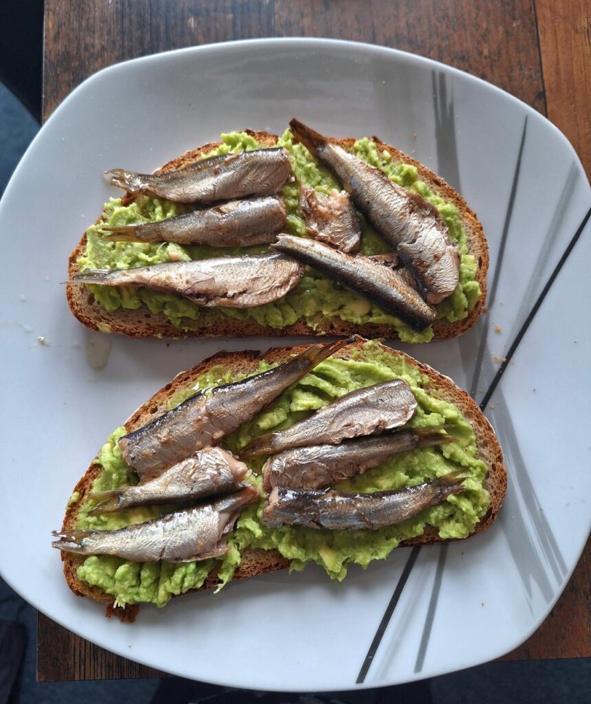 Canned sprats on avocado bread for Mom and baby