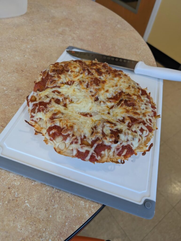 Sourdough Pizza. I ended up totally guessing on the recipe. It came out a little bready, but fully baked, and baked bread is delicious
