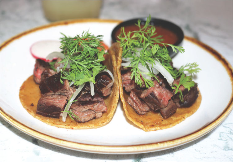 La Casa Purchase meat and garnish on tortilla