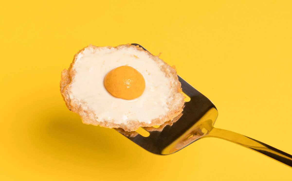 a vegan fried egg with a potato egg white and a sweet potato yolk