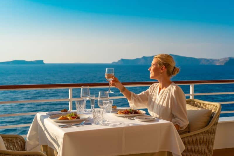 Luxury cruise dining with ocean views on the world residences at sea.