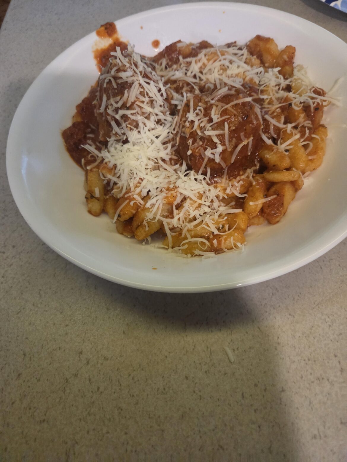 Home made Cavatelli, sauce and meatballs.