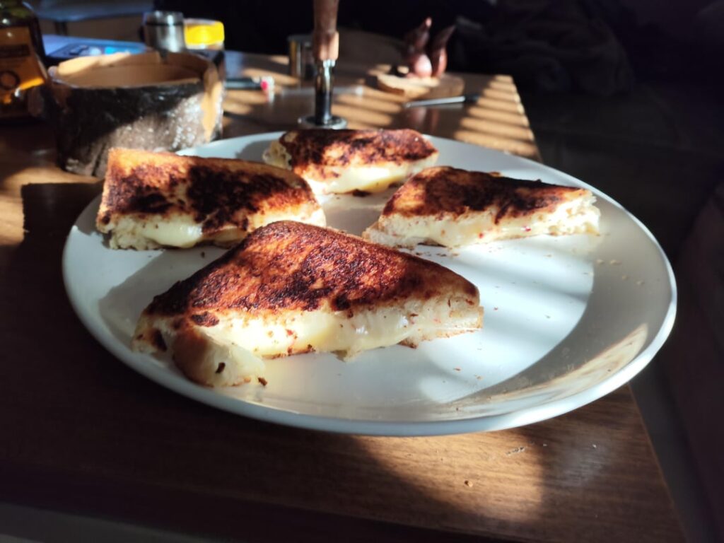 Bell pepper and onion semi solid grilled cheese sandwich.