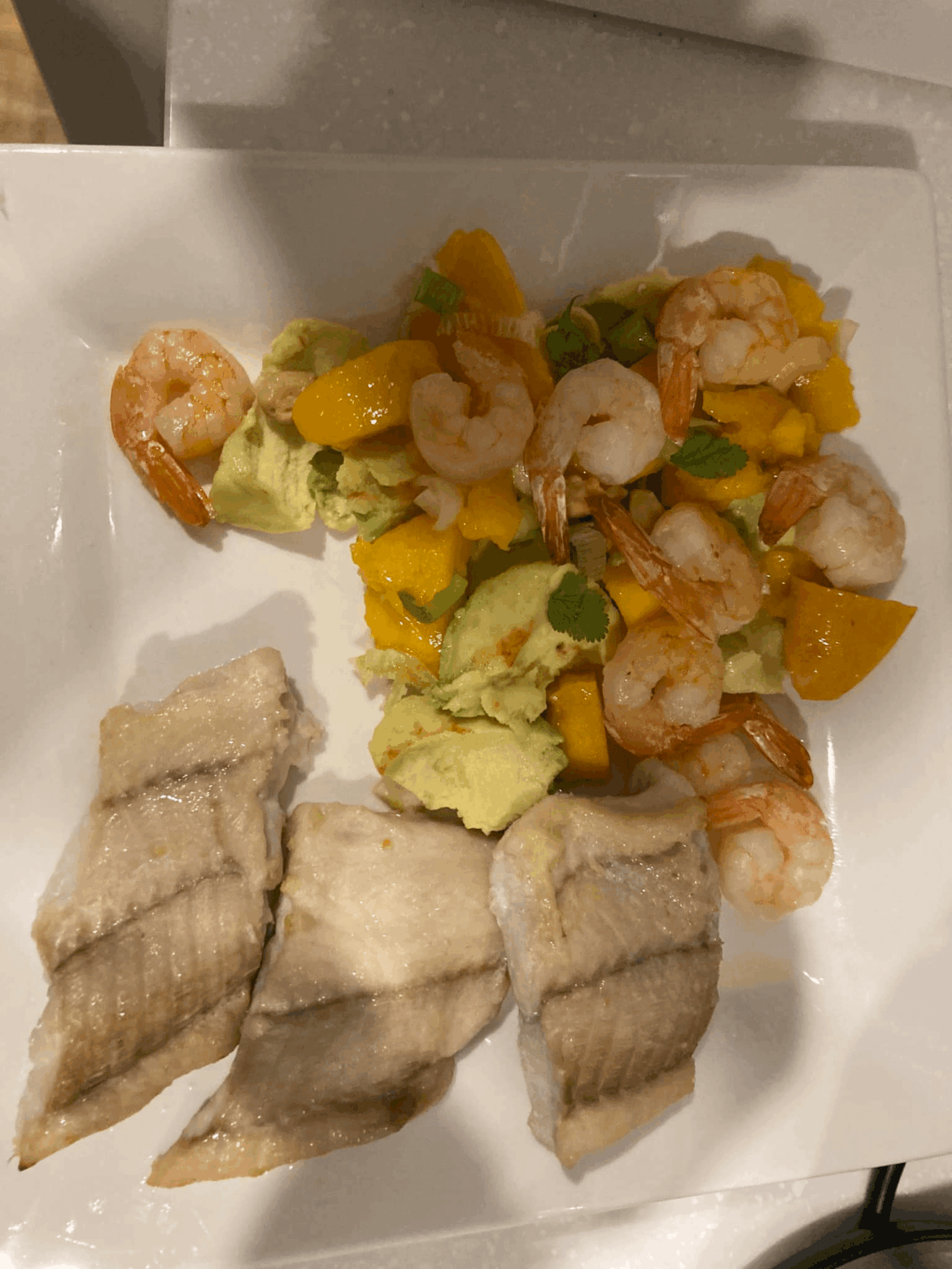 Chargrilled kingfish with mango, prawn and chilli salsa.