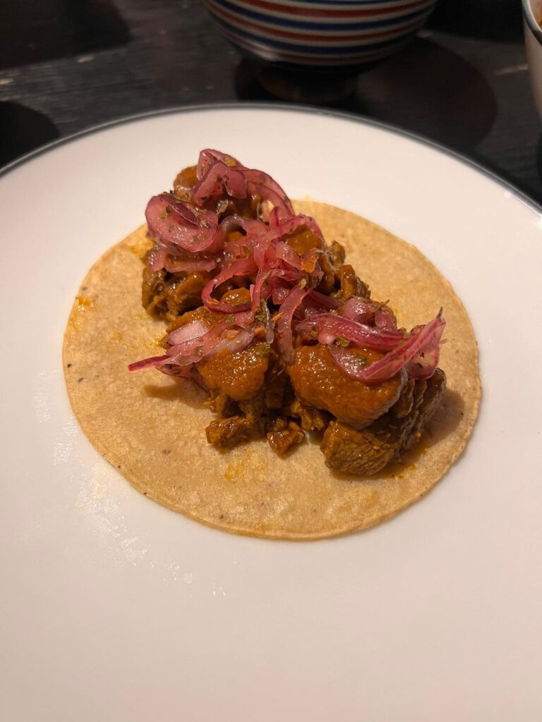 Barbacoa de cordero, salsa borracha, xnipek & homemade corn tortillas. And of course a mango jarrito on the side