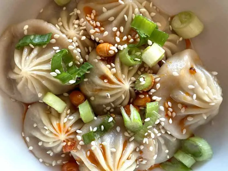 Mila Spicy hot pot beef soup dumplings up close.