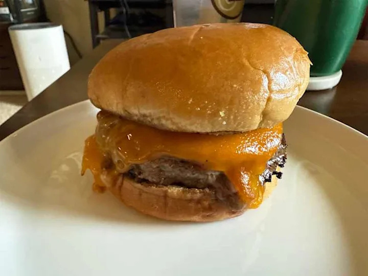 Cheese burger on plate.