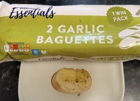 Everyday essential garlic baguette packet and slice on kitchen counter