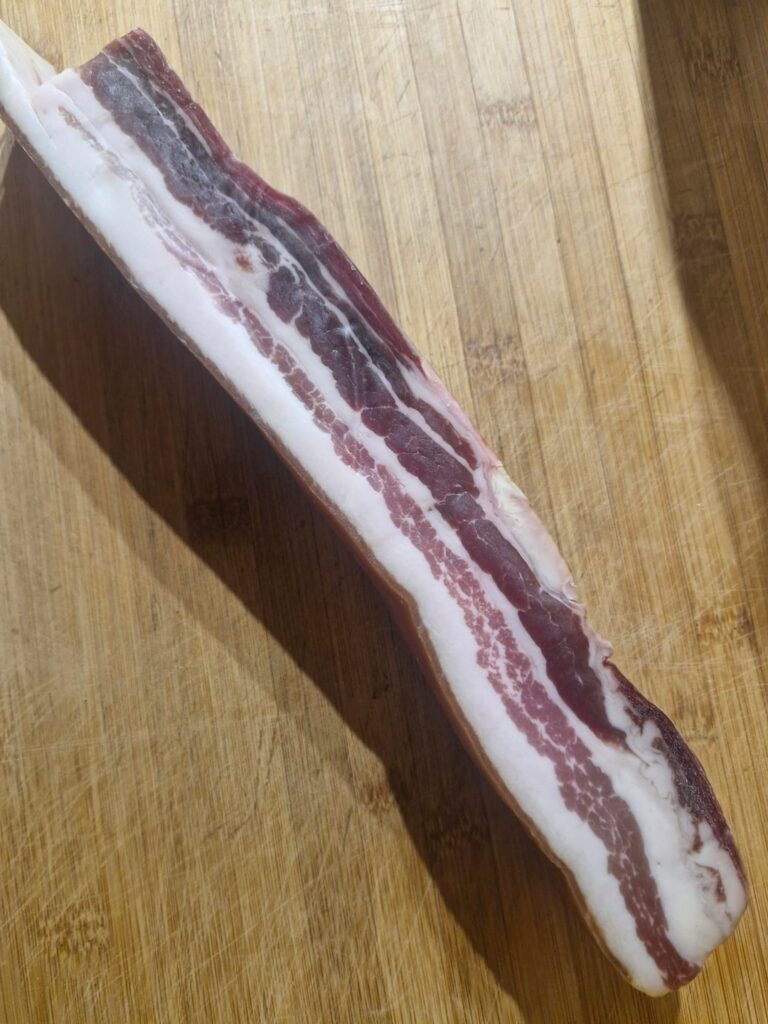 Homemade bacon smoked and cured on beechwood