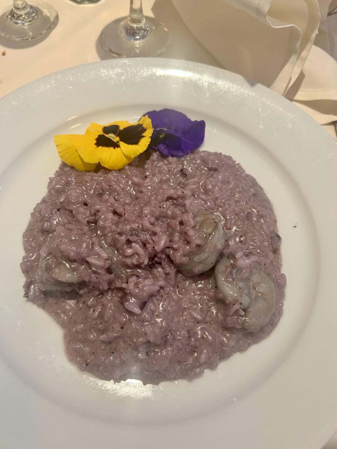 Risotto, mushrooms, blueberries, shrimp, edible flowers