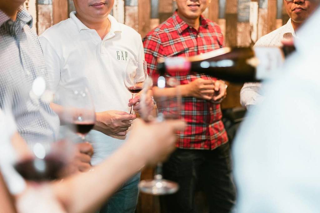 people drinking wine at a festival