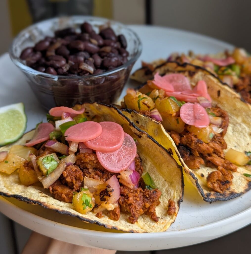 Mexikorean al pastor tacos with chipotle ginger black beans.