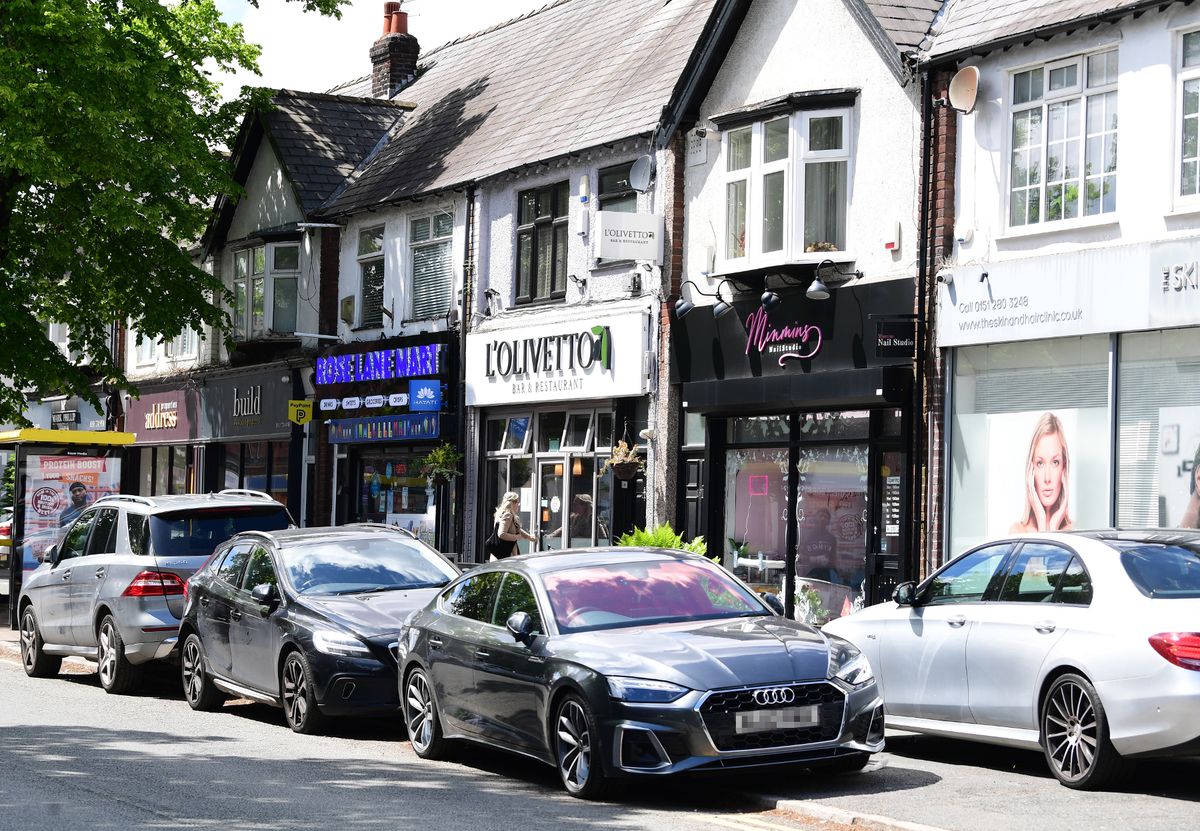 Cars parked on the pavement on Rose Lane.