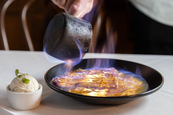 Crepes suzette are flamed in Grand Marnier at the table.