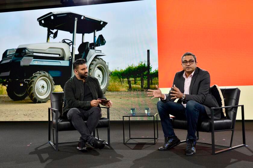 Nilay Patel and Praveen Penmetsa, both seated onstage