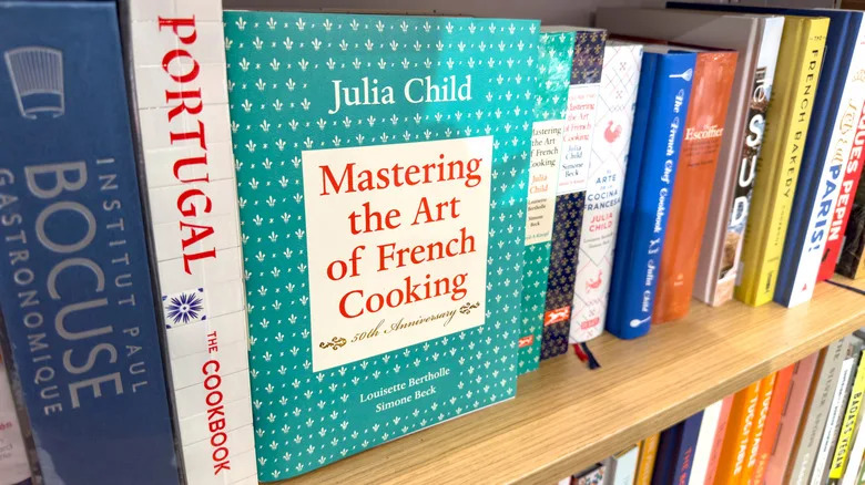 Mastering the Art of French Cooking displayed on a store shelf in a cookbook section.