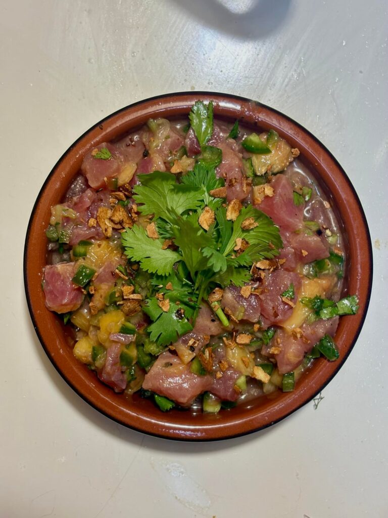 Ahi tuna ceviche peaches,jalapeños, cilantro, crispy garlic