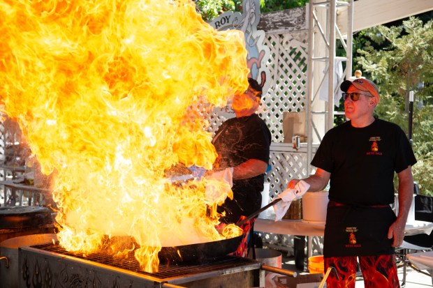 Rich Janisch, left, and his brother Steve Janisch, of Gilroy, make garlic calamari during the Gilroy Garlic Festival at Gilroy Gardens in Gilroy, Calif., on Friday, July 25, 2025. Friday marked the first day of the weekend-long festival, which had returned after a six-year hiatus. (Doug Duran/Bay Area News Group)