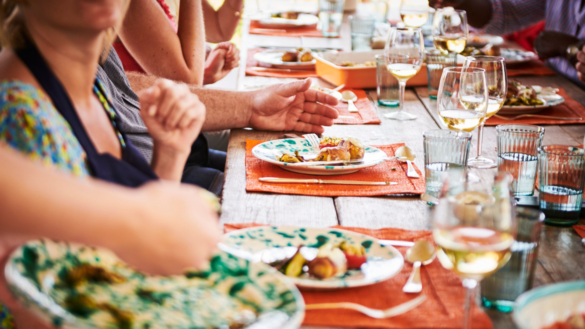 People with plates of food on a Stirred Travel trip