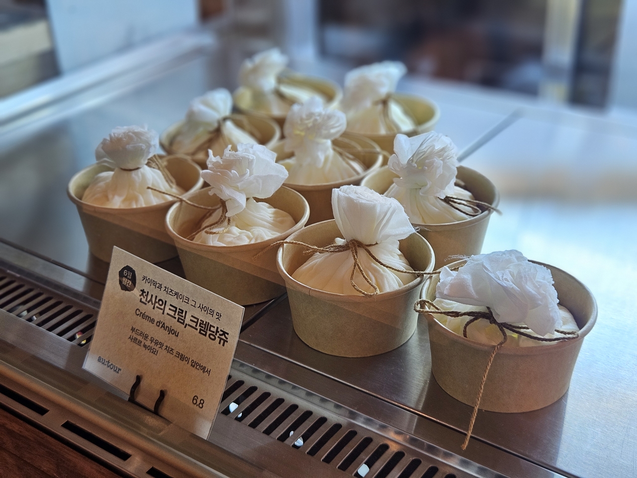 Otre Bakery releases a new "Monthly Otre" product each month, available for that month only; items that prove popular become permanent menu additions. Pictured is the June Monthly Otre product, "Angel's Cream, Crème d'Ange," on sale at the flagship store. (Jin Jin)