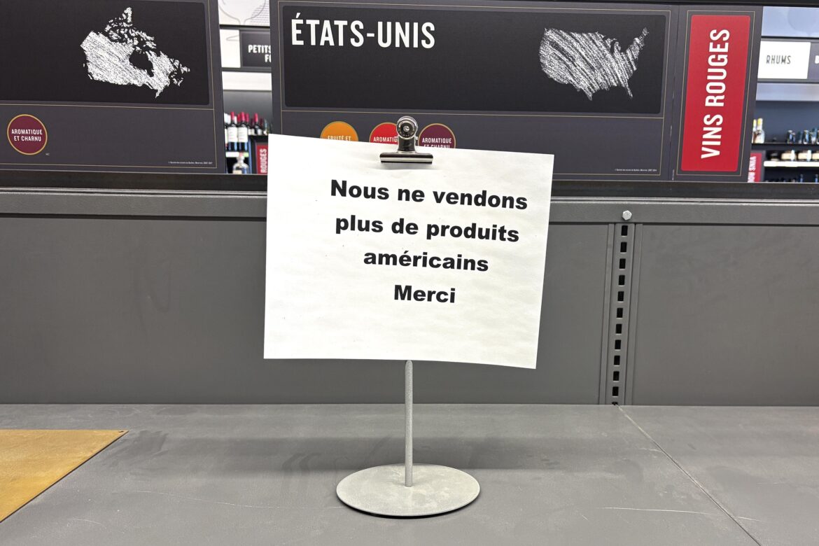 American wine back on Quebec shelves? Not yet, premier says Sign on shelf in SAQ outlet.
