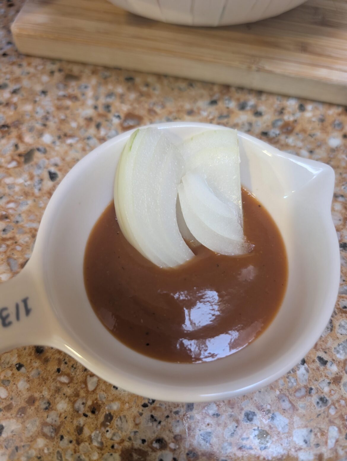my biggest pregnancy craving is big onion pieces dipped in barbecue sauce. don't worry there's a whole onion chopped up 🥲