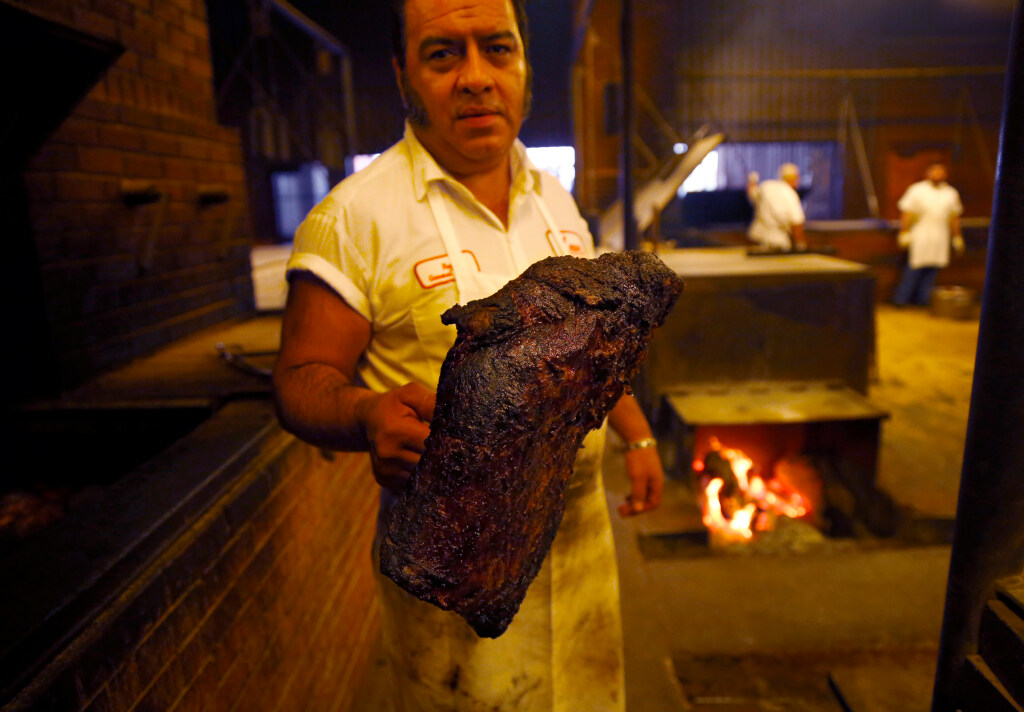 Pitmaster Roy Perez to retire after 39 years at Kreuz Market Pitmaster Roy Perez poses for a photo with a 15 pound brisket he was moving between pits at Kreuz Market, Saturday, February 9, 2013.
