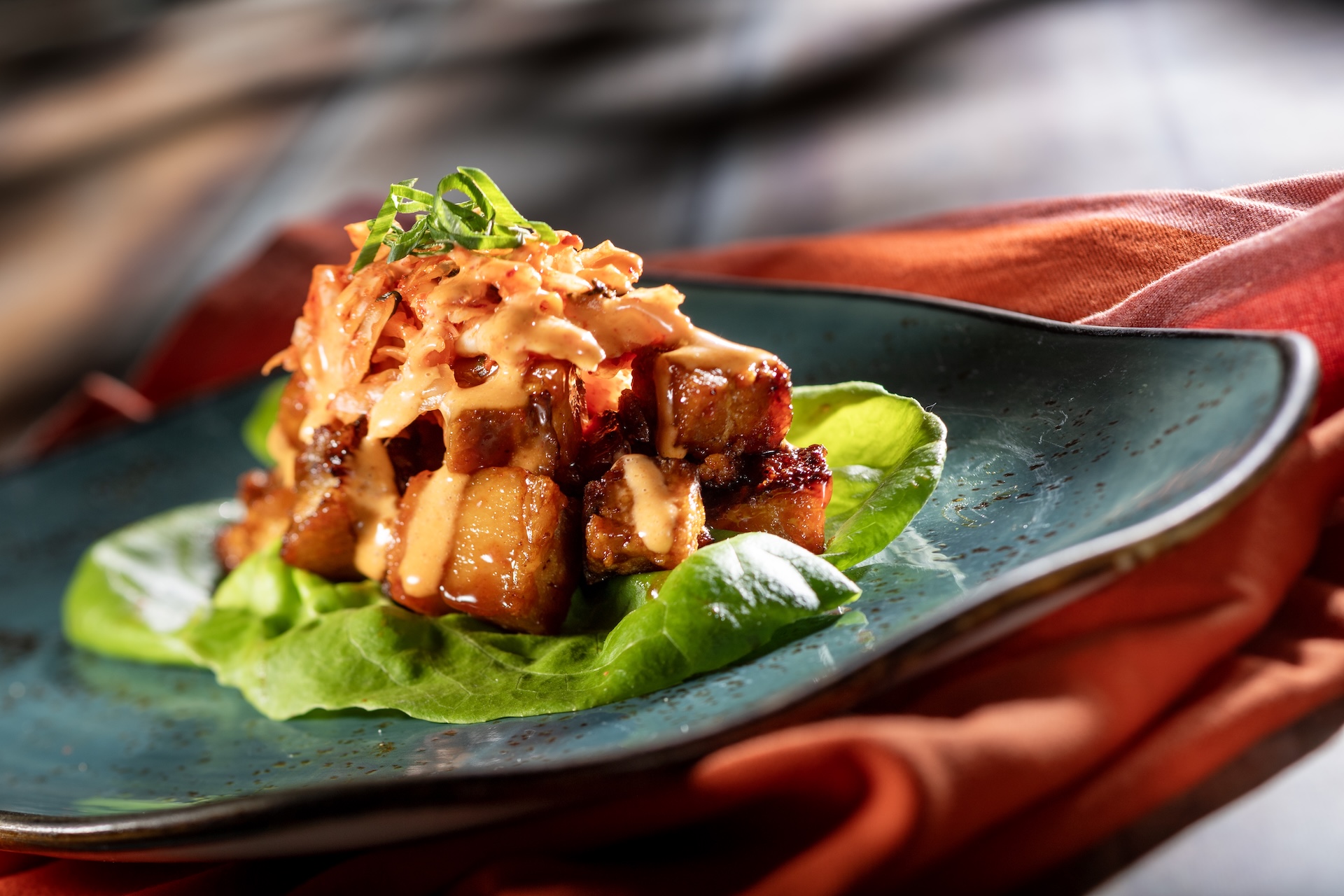 Bo Ssam Pork Belly Lettuce Wraps with bo ssam pork belly, kimchi slaw, and spicy aïoli (Introduced in 2010 at South Korea) (New)